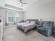 Spacious bedroom with a ceiling fan, large windows, and neutral decor at 3840 Se 6Th Ave, Ocala, FL 34480