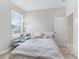 Bright bedroom with a cozy chair by the window and a comfortable bed at 3840 Se 6Th Ave, Ocala, FL 34480