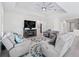 Cozy living room with a fireplace and comfortable seating, ideal for relaxation at 3840 Se 6Th Ave, Ocala, FL 34480