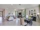 Open-concept living and dining area with stylish decor and large windows at 4050 Nw 48Th Terrace Rd, Ocala, FL 34482