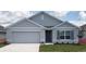 Charming single-story home features a two-car garage, well-maintained lawn, and stylish gray exterior at 4691 Sw 88Th Ln, Ocala, FL 34476