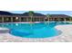 Large community pool featuring ample deck space, shallow end, and shade structure at 4691 Sw 88Th Ln, Ocala, FL 34476