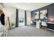 This room has carpet, a desk with a laptop and lamp, and a coatrack with a hat at 4714 Sw 88Th Ln, Ocala, FL 34476