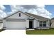Charming single-story home with a well-maintained lawn and a two-car garage at 4730 Sw 88Th Ln, Ocala, FL 34476