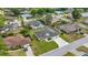 Spacious single-story home with a well-manicured lawn and a long driveway in a residential neighborhood at 5144 Ne 9Th St, Ocala, FL 34470