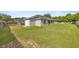 Well-maintained backyard with ample green space and privacy fencing at 5144 Ne 9Th St, Ocala, FL 34470