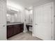 Bathroom featuring a granite vanity, makeup table, and lots of storage at 5144 Ne 9Th St, Ocala, FL 34470