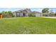 Beautiful single-story home with a lush green lawn and well-maintained landscaping at 5144 Ne 9Th St, Ocala, FL 34470