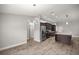 Open kitchen featuring stainless steel appliances, granite counters, and a stylish island with storage at 5144 Ne 9Th St, Ocala, FL 34470