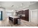 Spacious kitchen featuring a center island with seating and stainless steel appliances at 5144 Ne 9Th St, Ocala, FL 34470