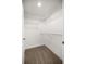 Carpeted walk-in closet with white walls and adjustable shelving at 5144 Ne 9Th St, Ocala, FL 34470