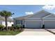 Charming single-story home featuring a brick driveway, attached two-car garage, and lush landscaping at 5339 Nw 46Th Lane Rd, Ocala, FL 34482