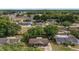 Aerial view of the property showcasing its location in a quiet neighborhood with nearby amenities and lush greenery at 5720 Se 22Nd Pl, Ocala, FL 34480