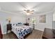 This primary bedroom features vinyl flooring, a ceiling fan, and a serene atmosphere at 5720 Se 22Nd Pl, Ocala, FL 34480
