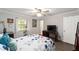 Comfortable bedroom with wood-look flooring, natural light and ceiling fan at 5720 Se 22Nd Pl, Ocala, FL 34480