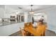 Dining room and kitchen showcasing an open layout and modern finishes at 5720 Se 22Nd Pl, Ocala, FL 34480