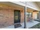 Inviting front porch with seating and a view of the well-manicured lawn at 5720 Se 22Nd Pl, Ocala, FL 34480