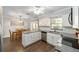 Kitchen with granite countertops and stainless steel appliances adjacent to a dining room at 5720 Se 22Nd Pl, Ocala, FL 34480