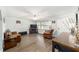 Bright living room featuring hardwood floors, comfortable seating, and a ceiling fan at 5720 Se 22Nd Pl, Ocala, FL 34480