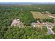 An aerial view of the property, highlighting its spacious lot and serene wooded surroundings at 6840 Sw 198Th Ave, Dunnellon, FL 34431