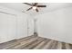 Bedroom featuring wood-look floors, ceiling fan, closet and a light-colored walls at 6840 Sw 198Th Ave, Dunnellon, FL 34431