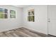 Well-lit bedroom showcases wood-look flooring and a bright interior with a convenient door at 6840 Sw 198Th Ave, Dunnellon, FL 34431