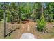 A long private driveway leads to a charming home nestled in a serene wooded setting at 6840 Sw 198Th Ave, Dunnellon, FL 34431