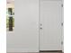 A white door with window and lightswitch is the first thing you see at 6840 Sw 198Th Ave, Dunnellon, FL 34431