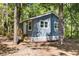 Charming single-story home featuring gray wood siding and a newly built wooden staircase at 6840 Sw 198Th Ave, Dunnellon, FL 34431