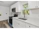 Newly remodeled kitchen featuring white cabinetry, modern hardware, and durable countertops at 6840 Sw 198Th Ave, Dunnellon, FL 34431