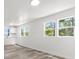 Spacious kitchen area with ample lighting, white cabinetry, and scenic outdoor views at 6840 Sw 198Th Ave, Dunnellon, FL 34431