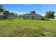 Lush lawn and house exterior featuring a patio set, perfect for enjoying outdoor living at 7886 Sw 103Rd Loop, Ocala, FL 34476