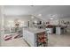 Open living room with kitchen island and spacious dining area, all with modern decor at 7886 Sw 103Rd Loop, Ocala, FL 34476