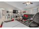 Inviting living room with plush sectional, stylish decor, and a view into the adjacent bathroom at 7886 Sw 103Rd Loop, Ocala, FL 34476