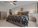 Comfortable main bedroom with closet, dresser, and bedside tables with lamps at 7886 Sw 103Rd Loop, Ocala, FL 34476