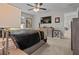 Main bedroom featuring carpet floors, ceiling fan, and furnishings at 7886 Sw 103Rd Loop, Ocala, FL 34476