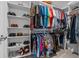 Spacious walk-in closet with organized shelving, providing ample storage for clothing and accessories at 7886 Sw 103Rd Loop, Ocala, FL 34476