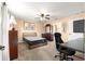 Comfortable bedroom with neutral tones, a ceiling fan, and space for a home office at 8 Hemlock Radl, Ocala, FL 34472