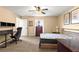 Bright bedroom featuring a ceiling fan and space for both a bed and desk area at 8 Hemlock Radl, Ocala, FL 34472