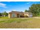 Attractive ranch-style home with a manicured lawn and an attached two-car garage at 8 Hemlock Radl, Ocala, FL 34472