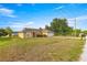 Inviting one-story home with a neat front yard, lovely landscaping, and a convenient two-car garage at 8 Hemlock Radl, Ocala, FL 34472