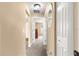 Bright hallway with natural light that connects to multiple rooms of the house at 8 Hemlock Radl, Ocala, FL 34472