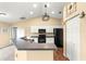 A well-lit kitchen featuring white cabinetry and modern appliances at 8 Hemlock Radl, Ocala, FL 34472