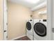 Convenient laundry room featuring a new washer and dryer set and ample storage space at 8 Hemlock Radl, Ocala, FL 34472