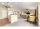 Inviting living room and dining area with an open concept design and plenty of natural light at 8 Hemlock Radl, Ocala, FL 34472