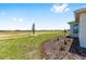 Well-maintained backyard featuring lush lawn and freshly mulched flower beds, providing curb appeal at 8497 Sw 99Th Cir, Ocala, FL 34481