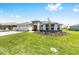 Beautiful single-story home with a well-maintained lawn, three-car garage, and inviting curb appeal at 8497 Sw 99Th Cir, Ocala, FL 34481