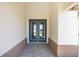 Elegant double front doors with decorative glass panels on a charming exterior walkway at 8497 Sw 99Th Cir, Ocala, FL 34481
