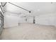 A clean, spacious two car garage with a water heater and two doors to the rest of the house at 8497 Sw 99Th Cir, Ocala, FL 34481