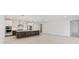 Modern kitchen with stainless steel appliances and large island at 8497 Sw 99Th Cir, Ocala, FL 34481